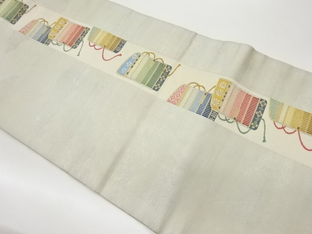 縞に縅毛・雲模様織出し名古屋帯